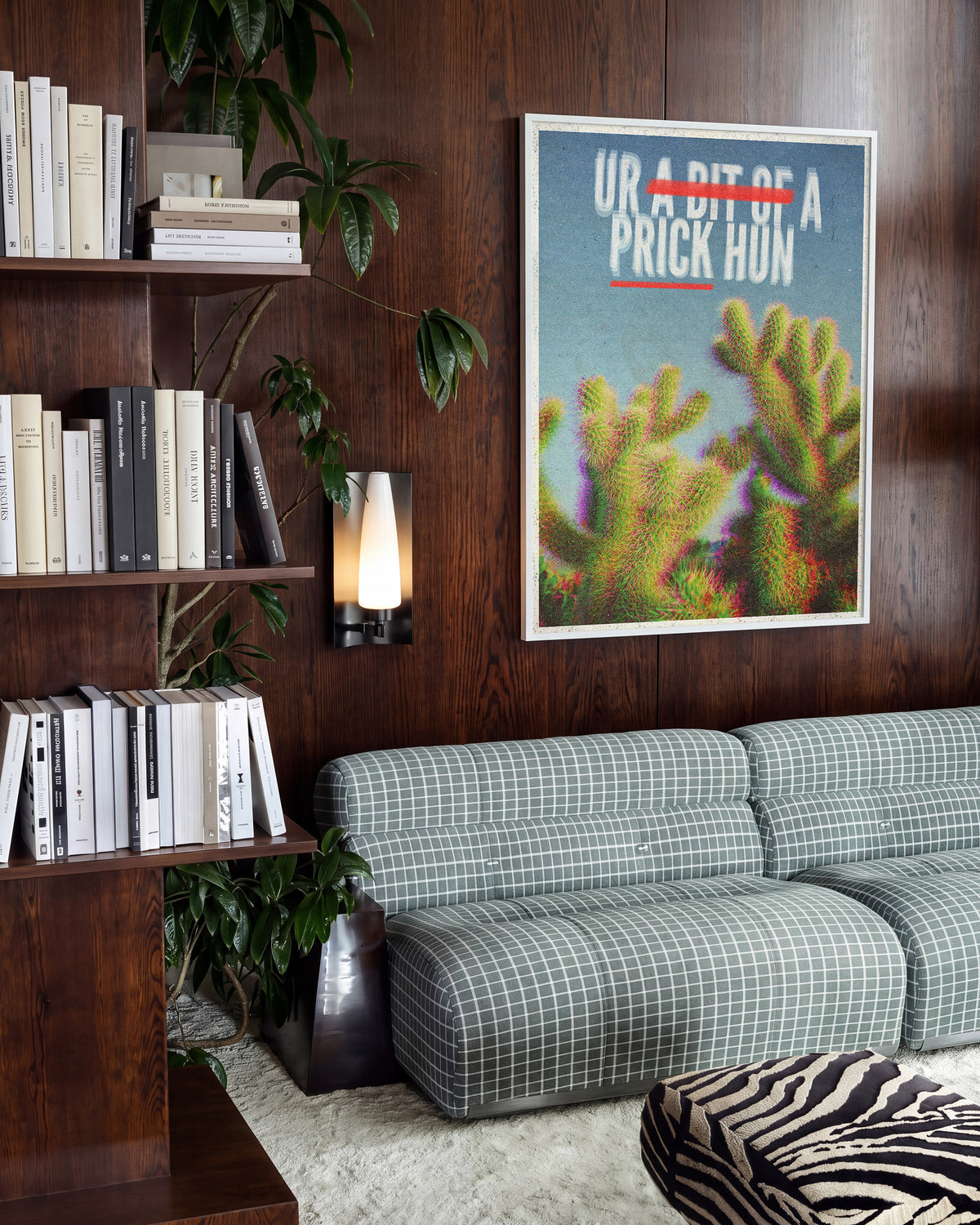 Bit of a Prick funny cactus quote poster in a white frame on a wall