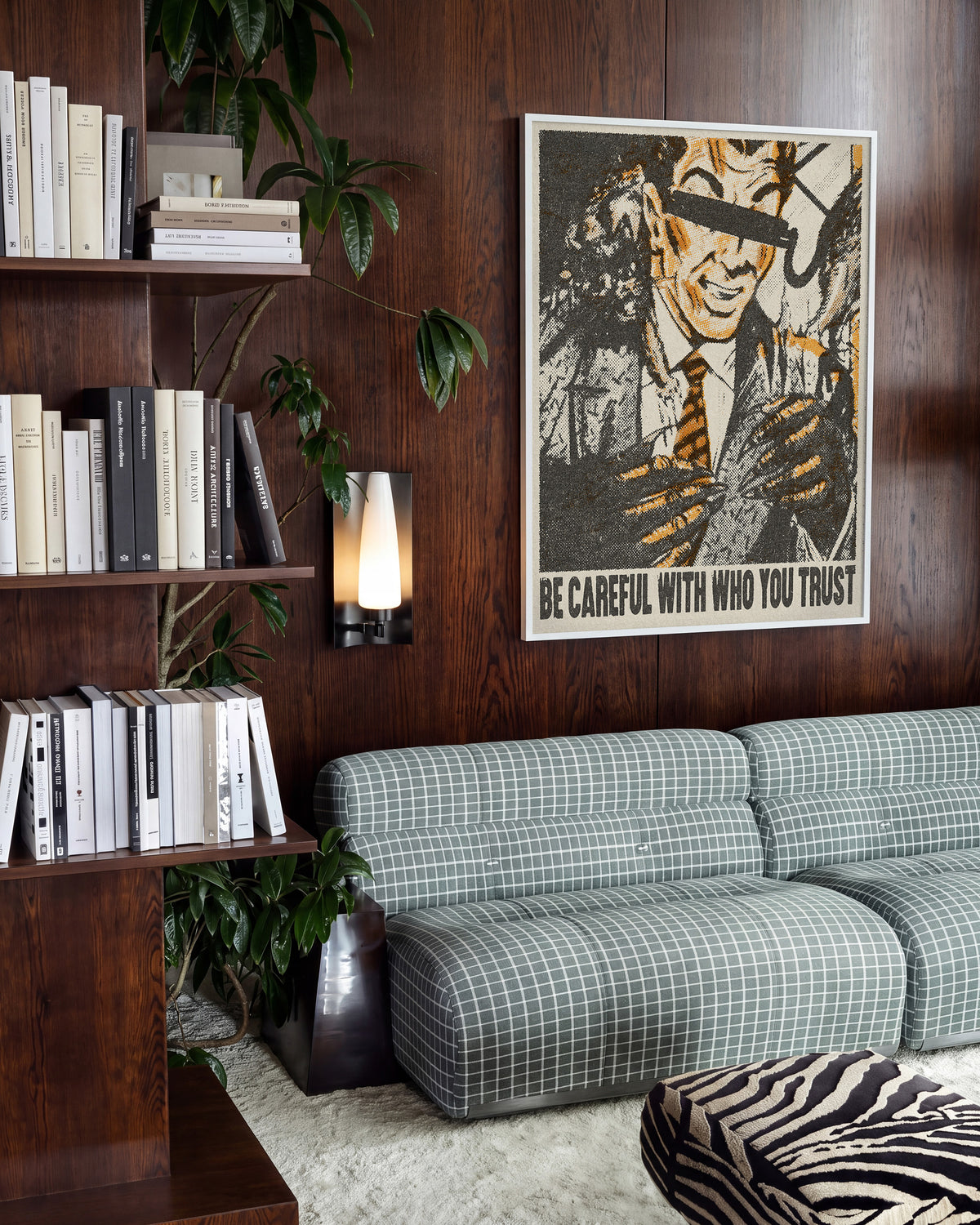 Be Careful Who You Trust retro quote poster in a white frame on a wall