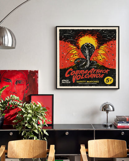 Cobra Attack Volcanoa vintage cobra tattoo print in a black frame on a wall