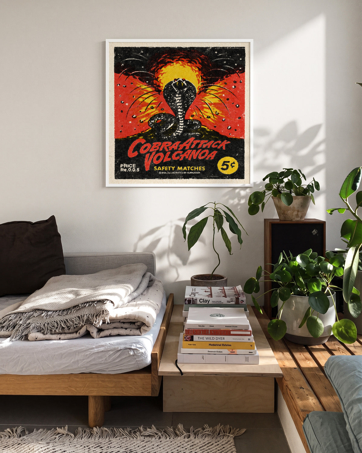Cobra Attack Volcanoa vintage cobra tattoo print in a white frame on a wall