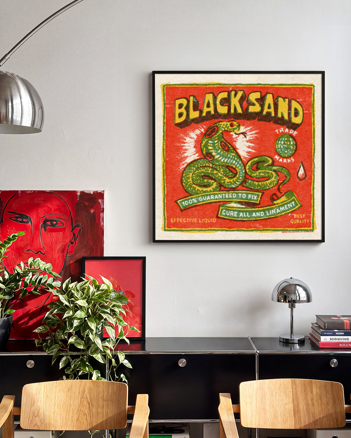 Black Sand Cobra vintage cobra tattoo print in a black frame on a wall