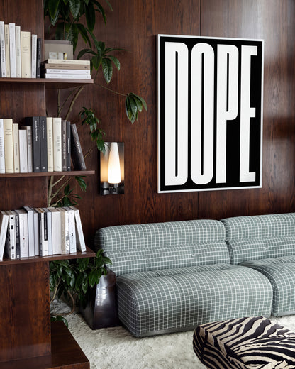Dope typography poster in a white frame on a room wall