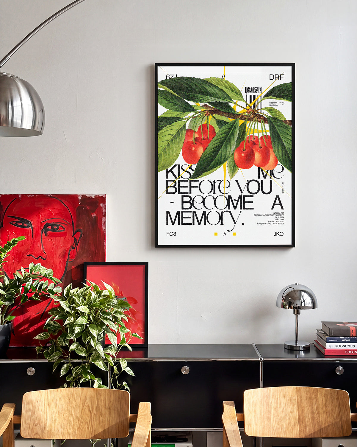 Kiss Me romantic quote poster in a black frame on a room wall